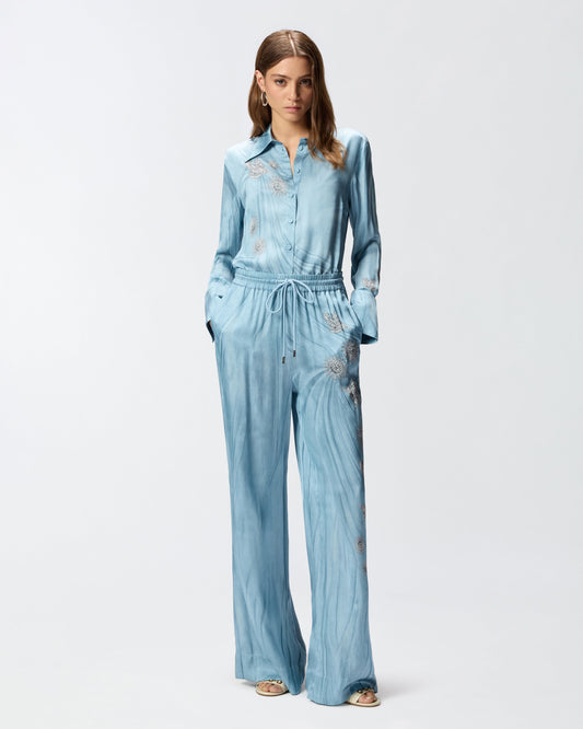 Fluid trousers with placed jewel print