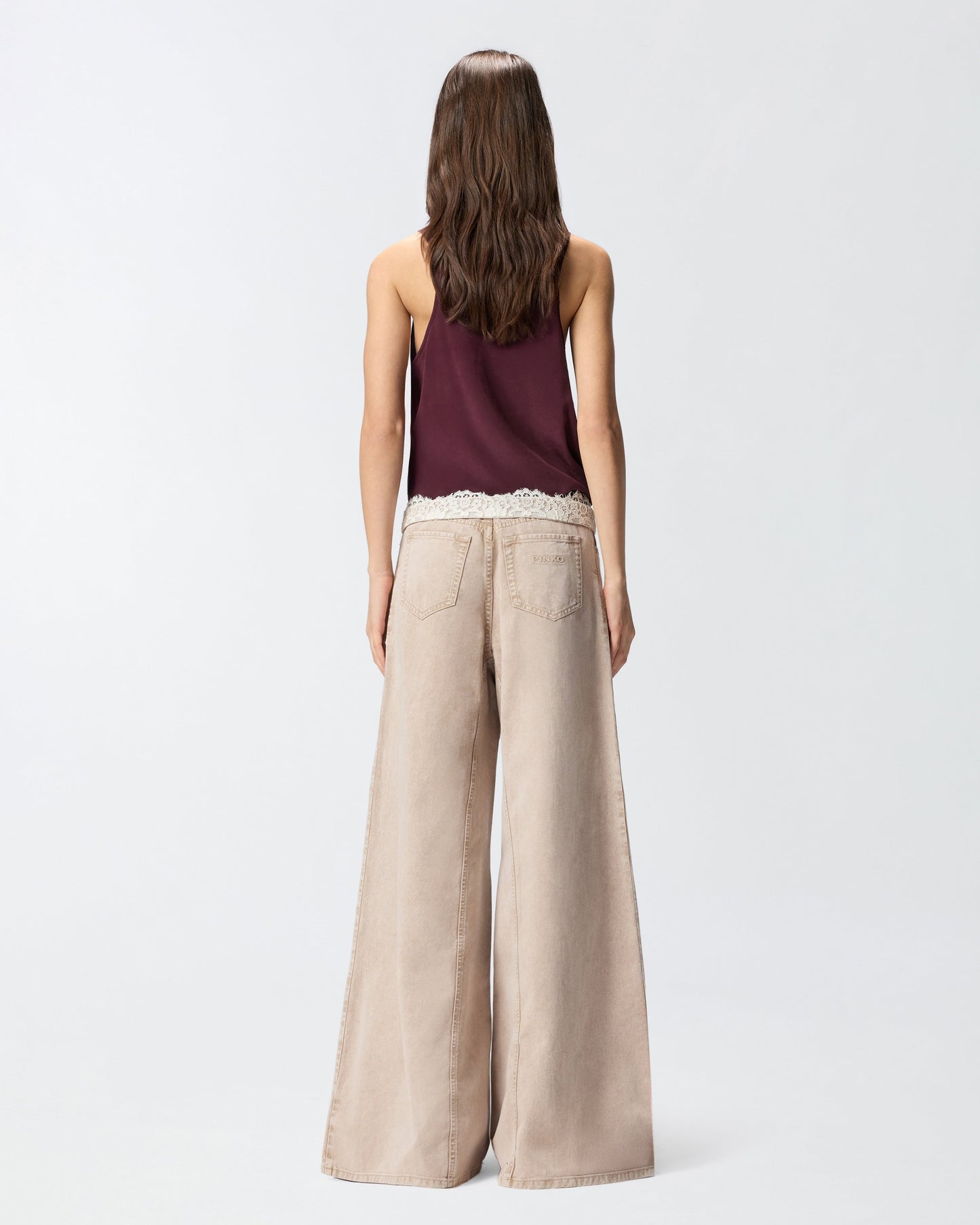 Brown jeans with lace at the waist