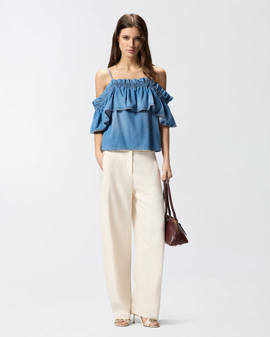 Denim top with ruffle and open shoulders