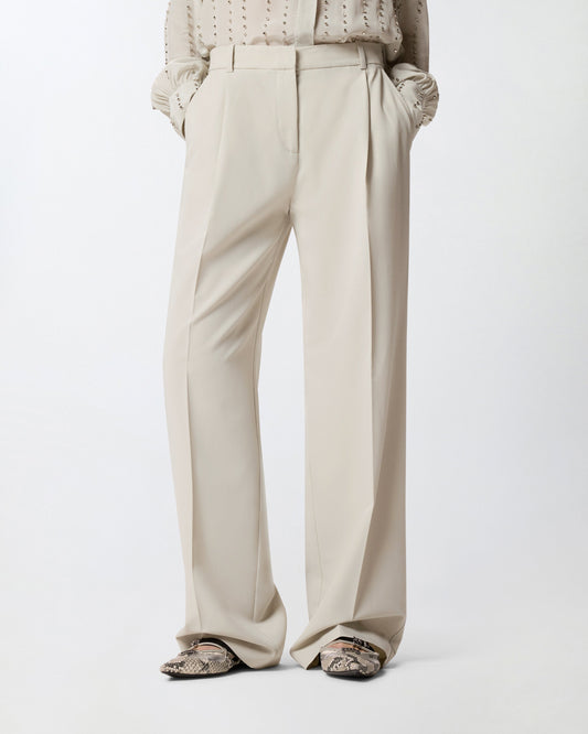 Flowing trousers with pressed pleat detail