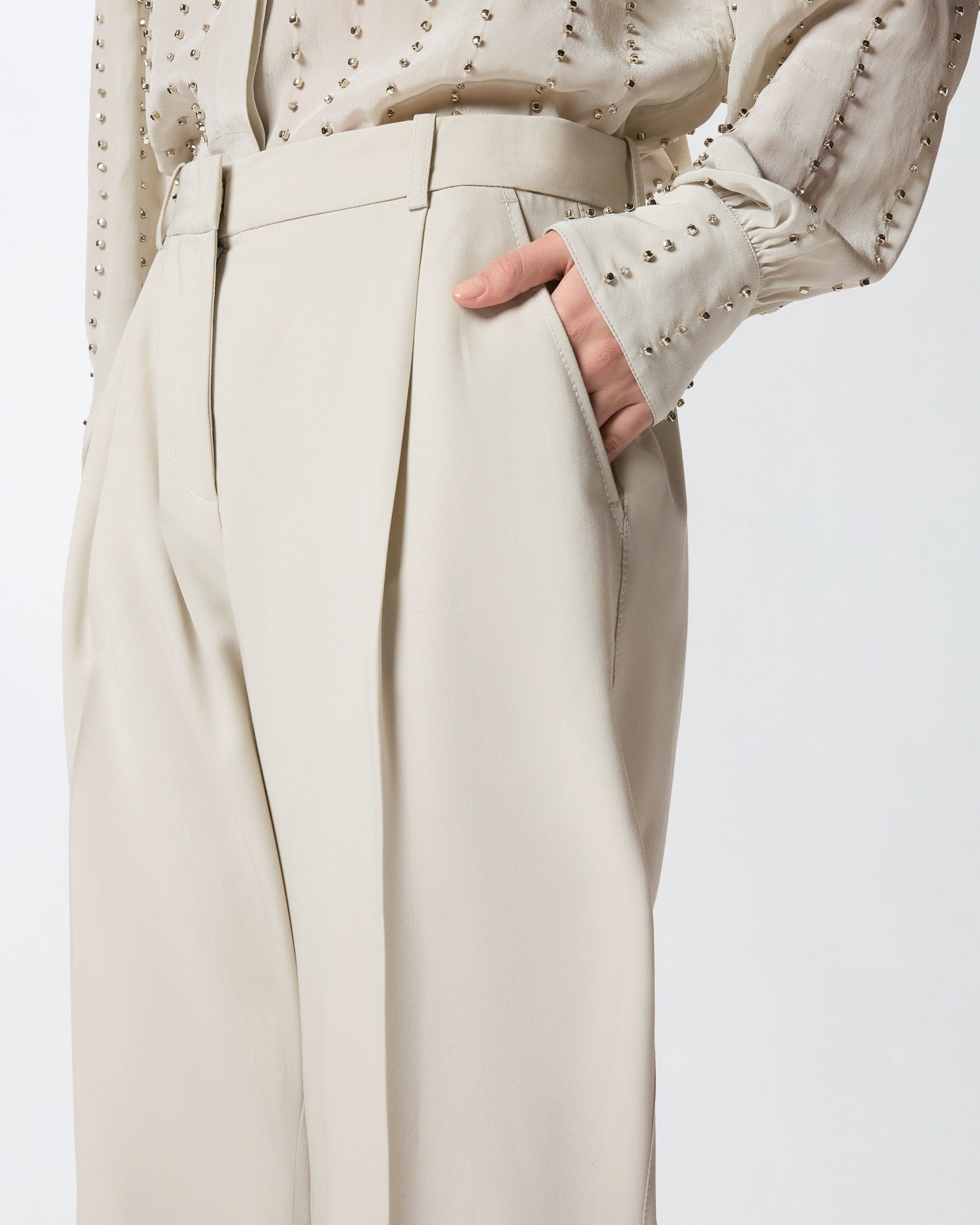 Flowing trousers with pressed pleat detail