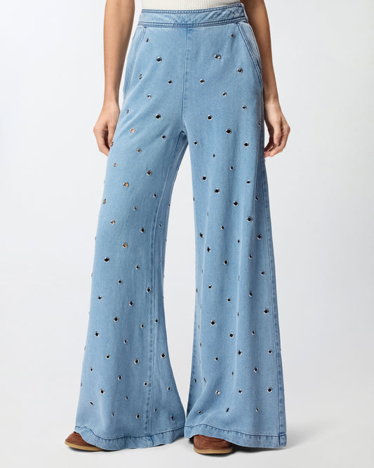 Denim jeans with eyelets