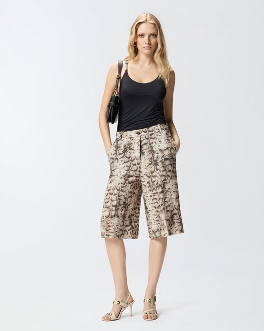 Bermuda shorts with snake print