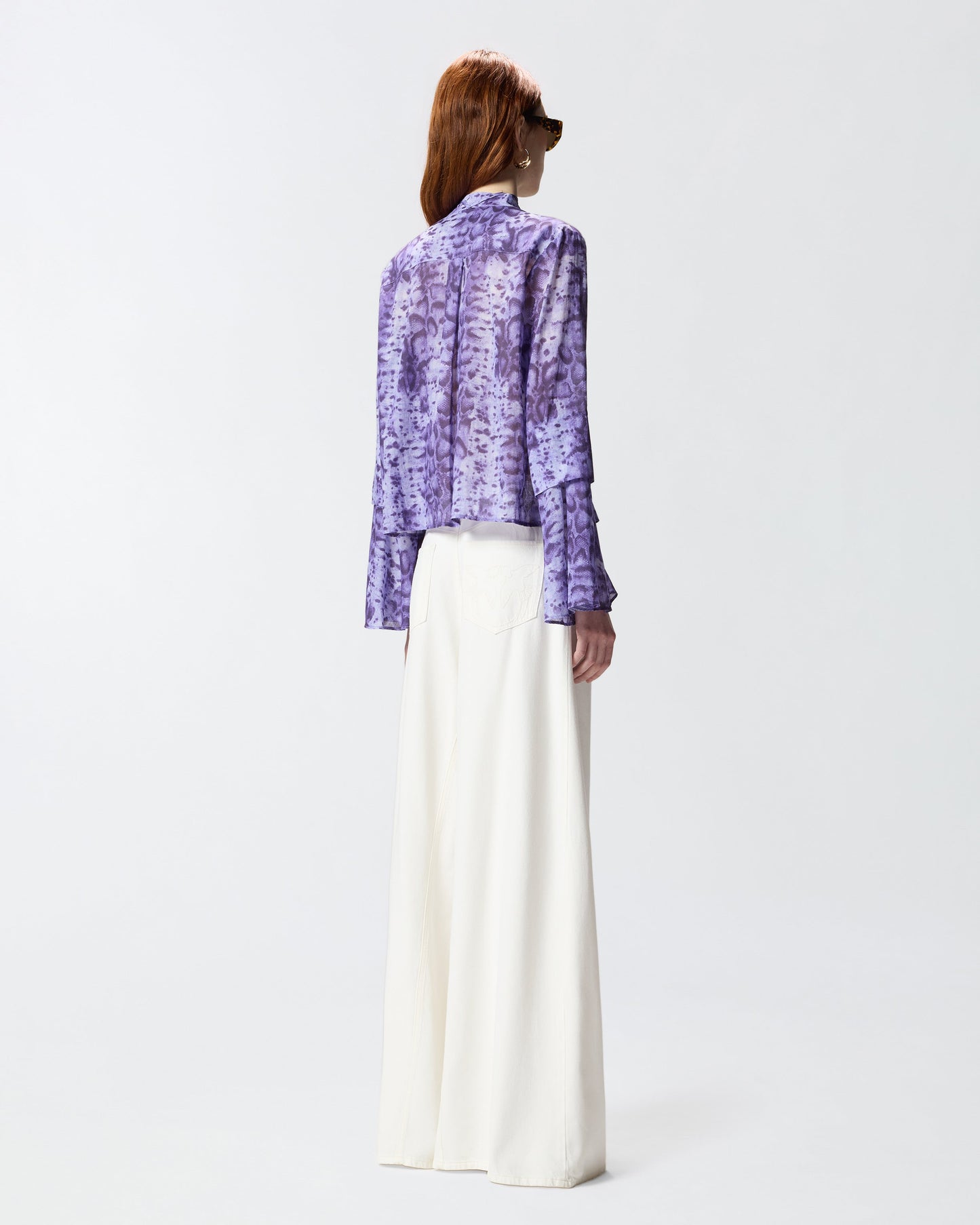 Blouse with snake print and jewel buttons