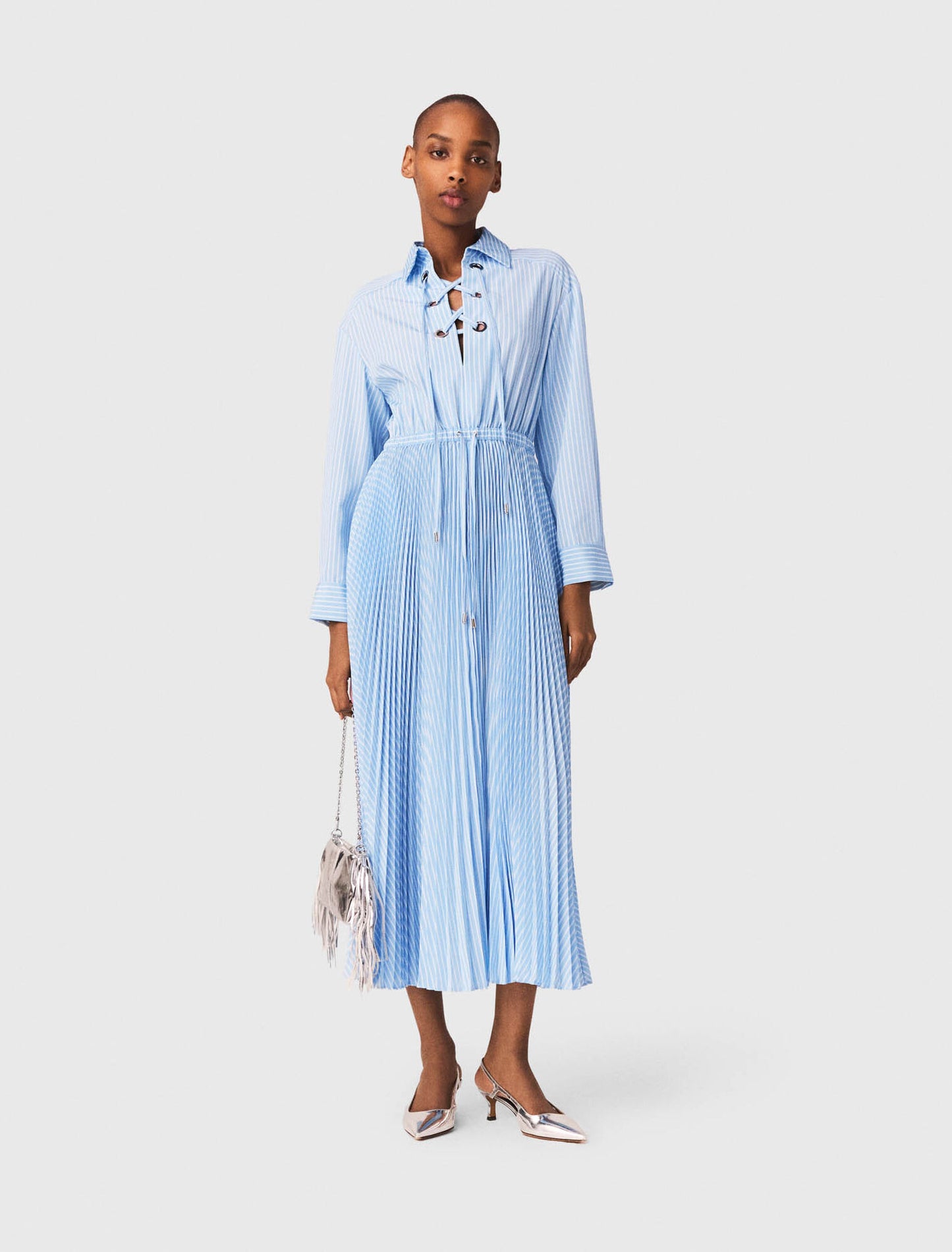Long pleated dress with eyelets